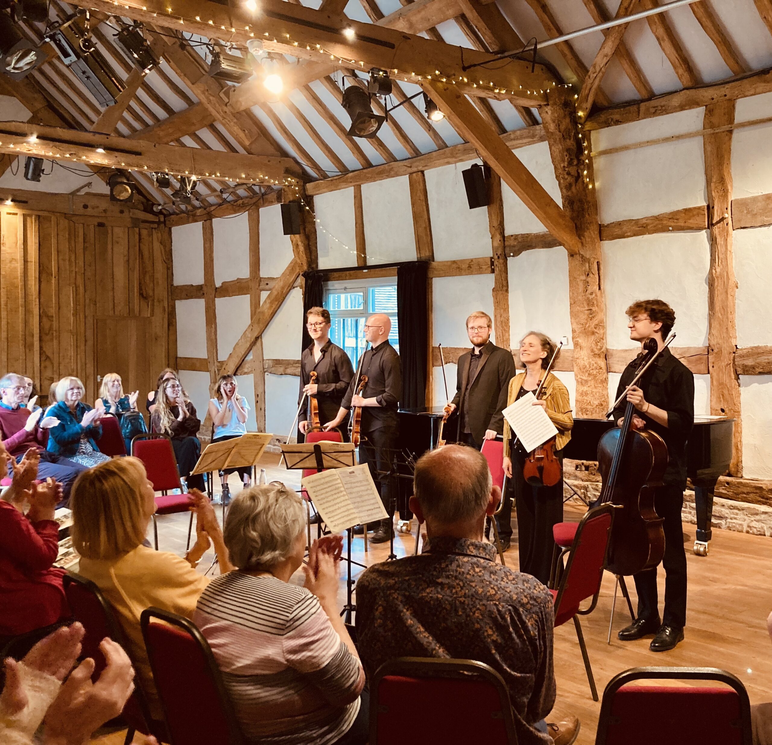 Musicians receiving applause from audience members